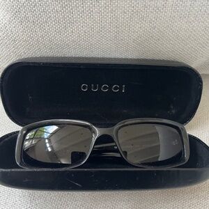 Black vintage women’s Gucci sunglasses with case